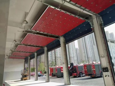 Industrial lifting doors are used in fire stations and can be opened manually when power is off